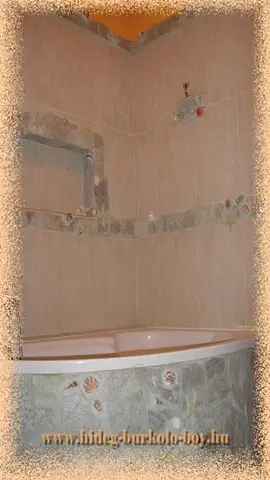 fürdőszoba beépített kád természetes kő burkolás